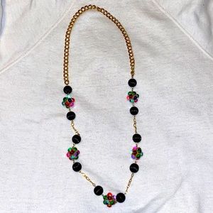 Multi colored beaded necklace with gold chain.